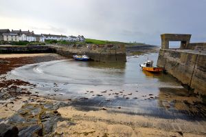 Low tide renders Craster harbour silent